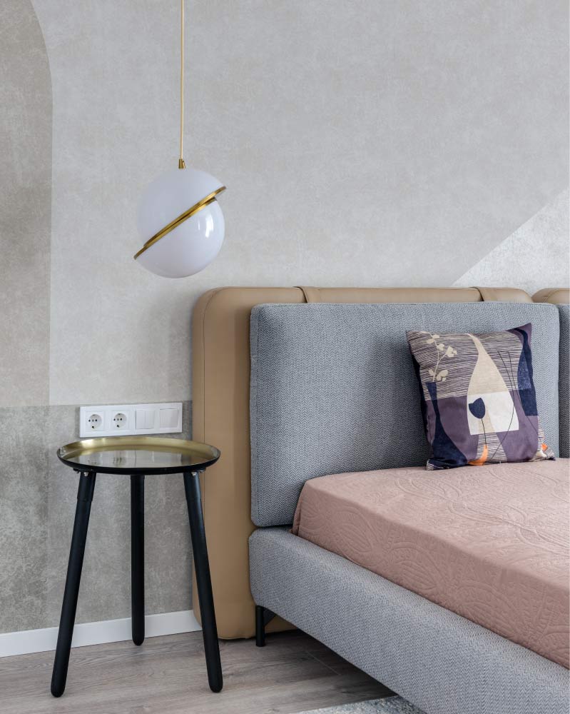 A minimal grey bedroom with a pendant lamp and side table - Beautiful Homes A minimal grey bedroom with a pendant lamp and side table - Beautiful Homes