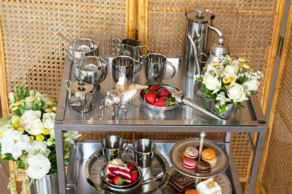A steel trolley filled with stainless steel utensils