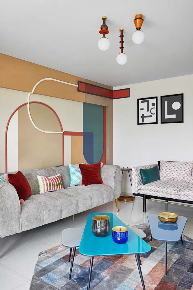 A living room with accustomed mural on the wall A living room with accustomed mural on the wall