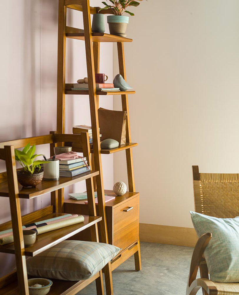 A wooden shelf with a chair and accessories  A wooden shelf with a chair and accessories
