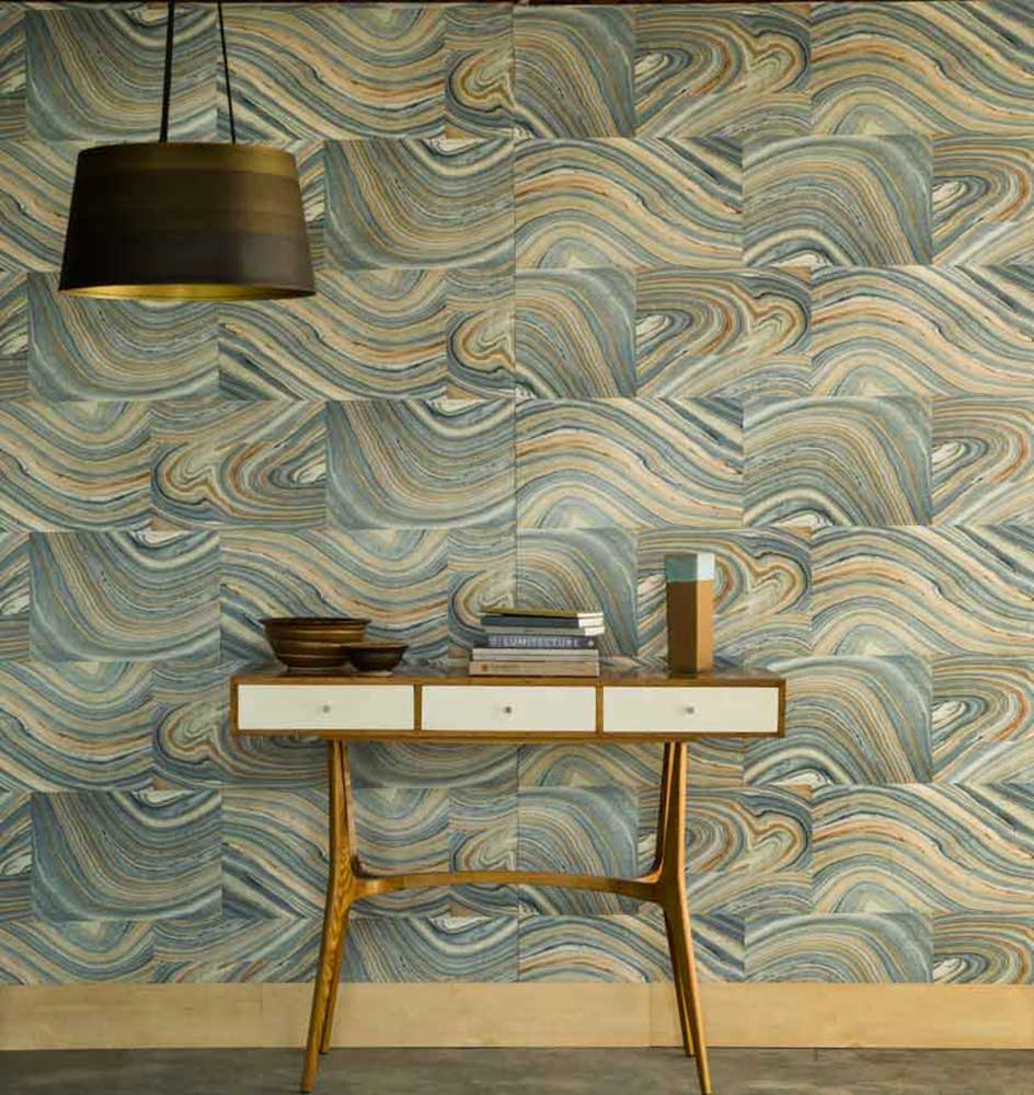 A console table with a pendant lamp in front of a wall A console table with a pendant lamp in front of a wall