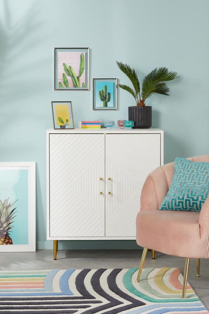 A blue room with a pink chair Monaco Frame