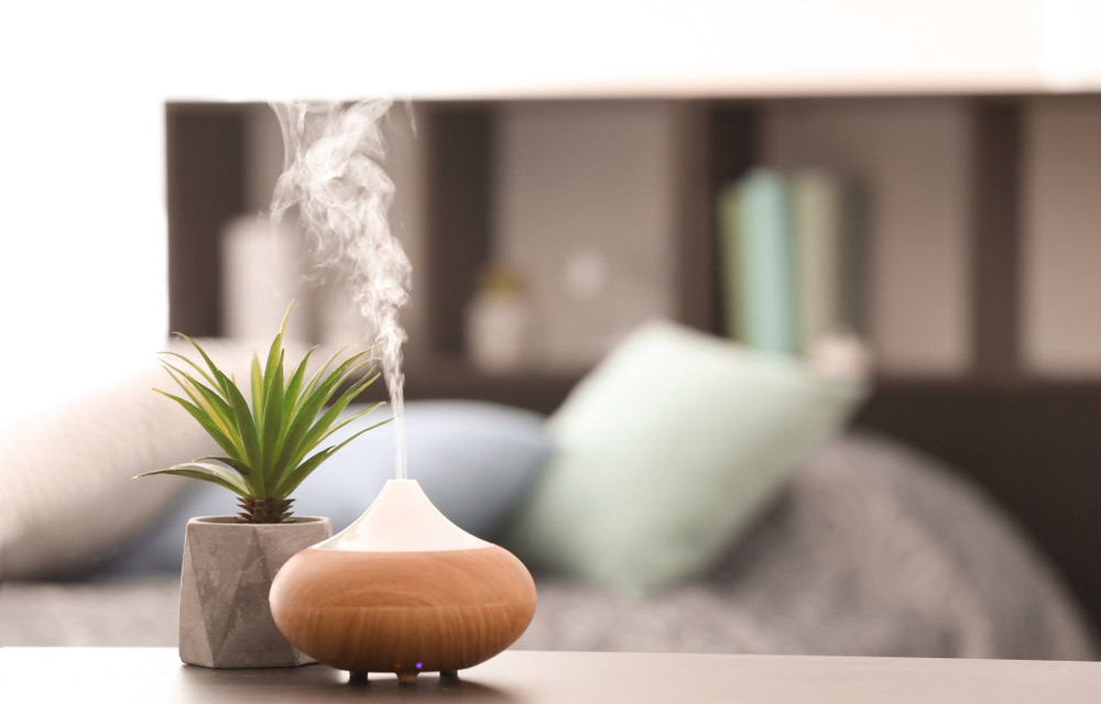 A humidifier kept on a table Aroma lamp on table