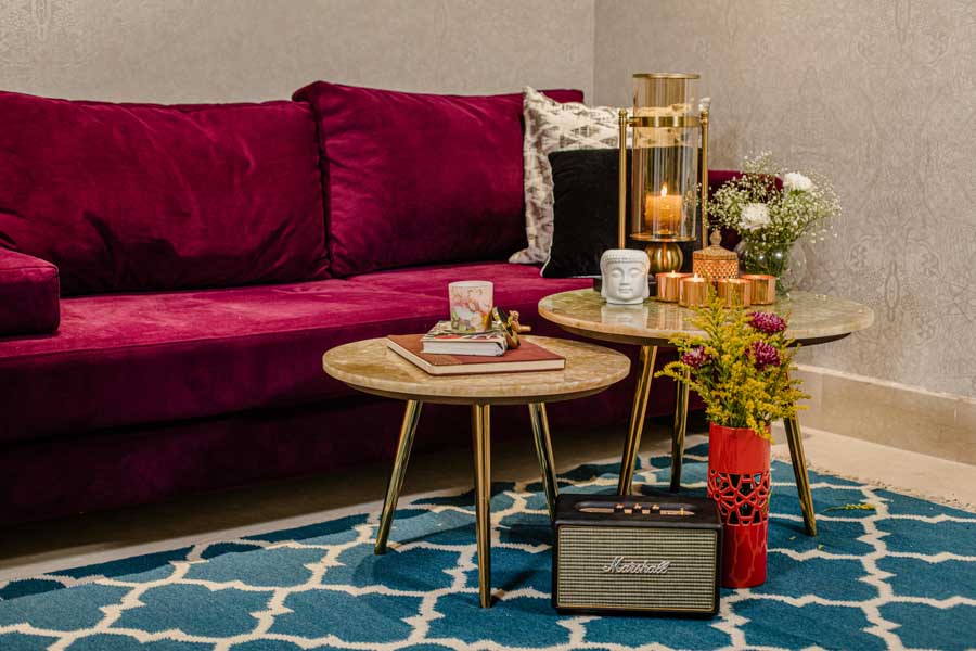 Home Décor for Dussehra With Fresh Flowers - Beautiful Homes Home Décor for Dussehra With Fresh Flowers, Red Velvet Sofa, Centre Table & Blue Rug - Beautiful Homes