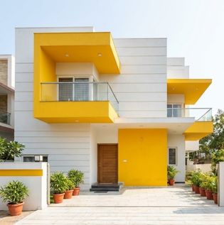 Bright Yellow and White Home Front Elevation