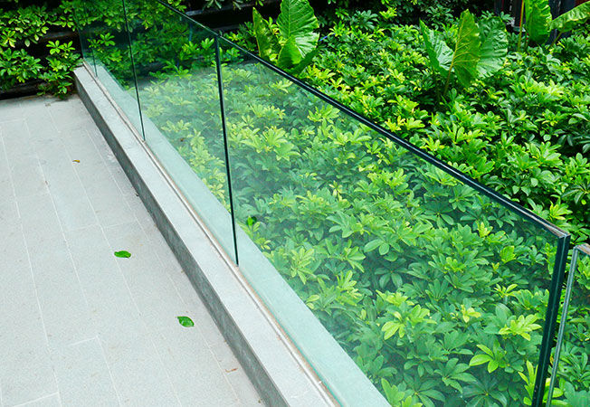 Selective focus outdoor frameless glass railing - Asian Paints