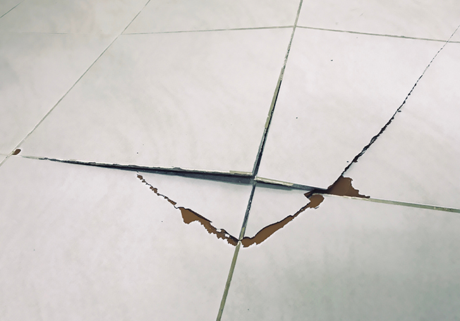 Chipped tile for lack of waterproofing - Asian Paints