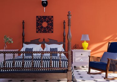 Rustic-Bedroom-with-Orange-Wall-m