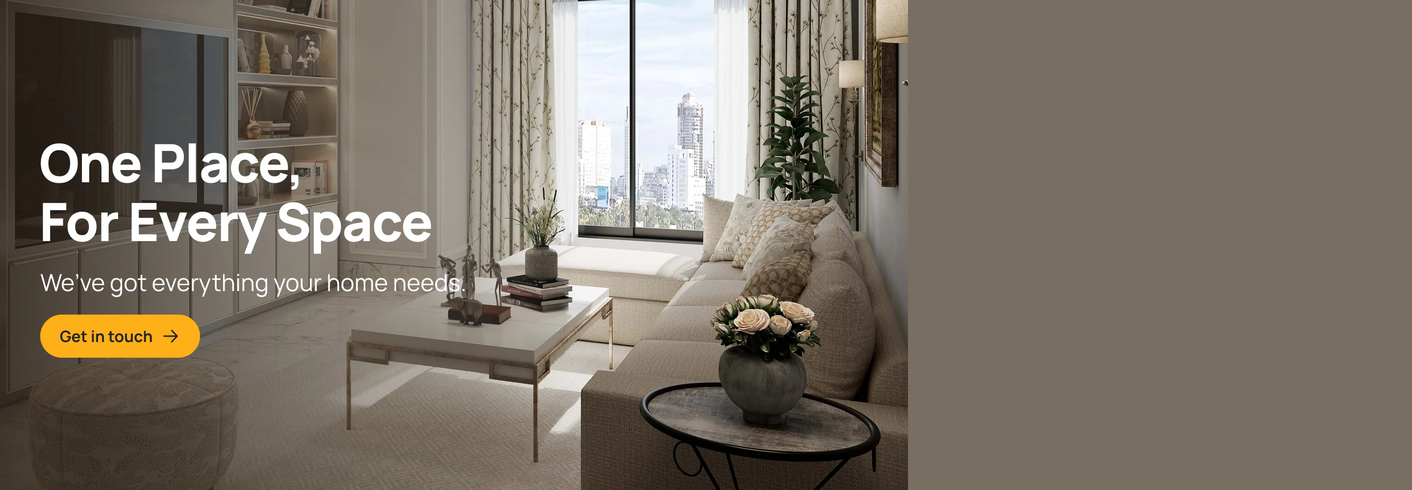 A living room with beige walls with special finishes and decorated with a coffee table, sofa set, large area rug, and pillows and throws.