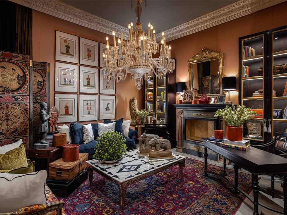 Maximalism design with low-hanging chandelier - Beautiful Homes