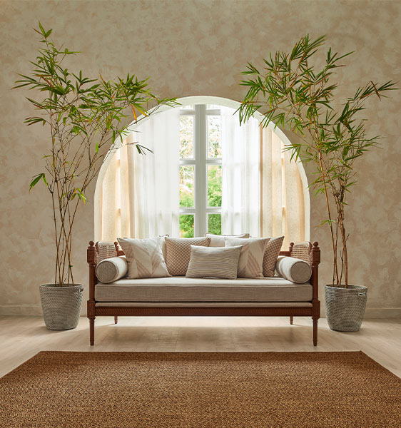 Entrance hall arch design with sofa & plant décor - Beautiful Homes