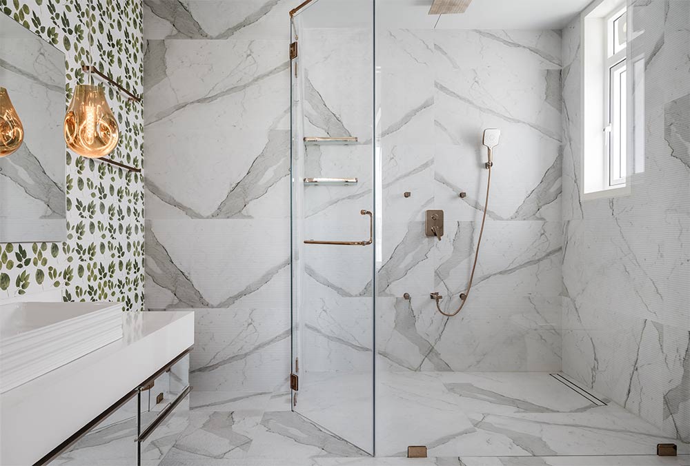 Marble bathroom tiles with glass partition for shower area - Beautiful Homes