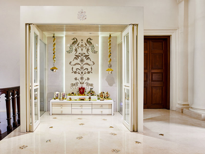 Glass mandir design with floral decoration - Beautiful Homes