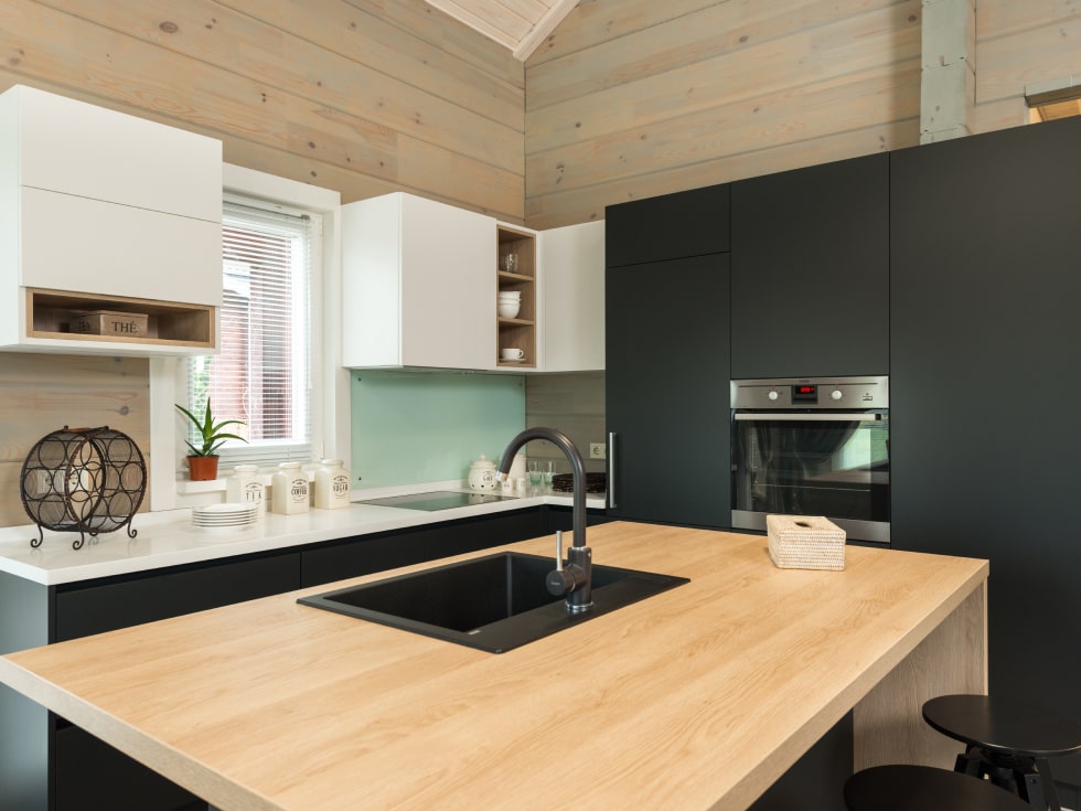 Kitchen cabinets installed on the kitchen backsplash area for storage - Beautiful Homes