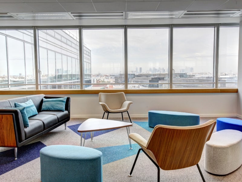 Large bay window design in a industrial style living room - Beautiful Homes