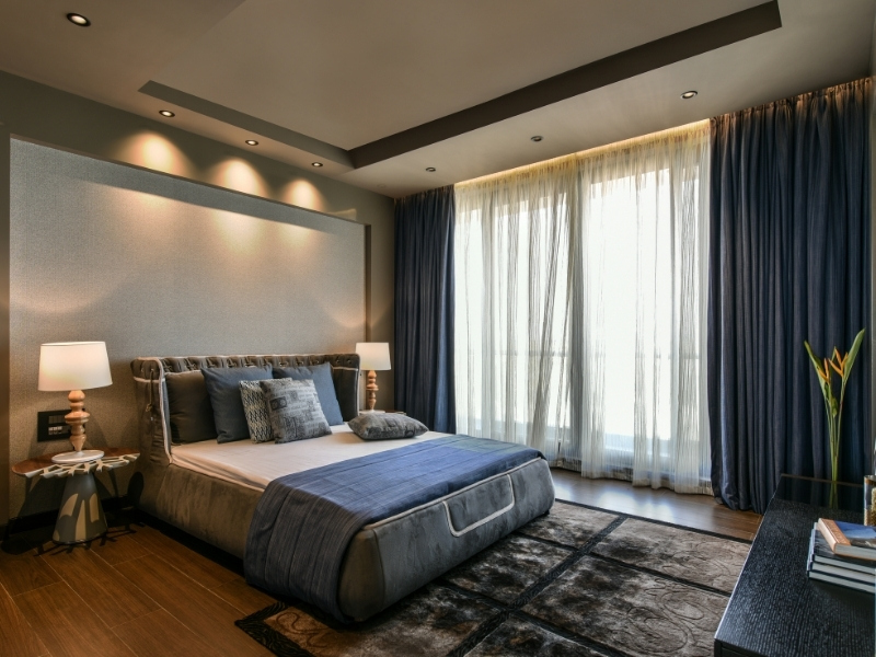 Classy style interiors with long curtains for bedroom - Beautiful Homes