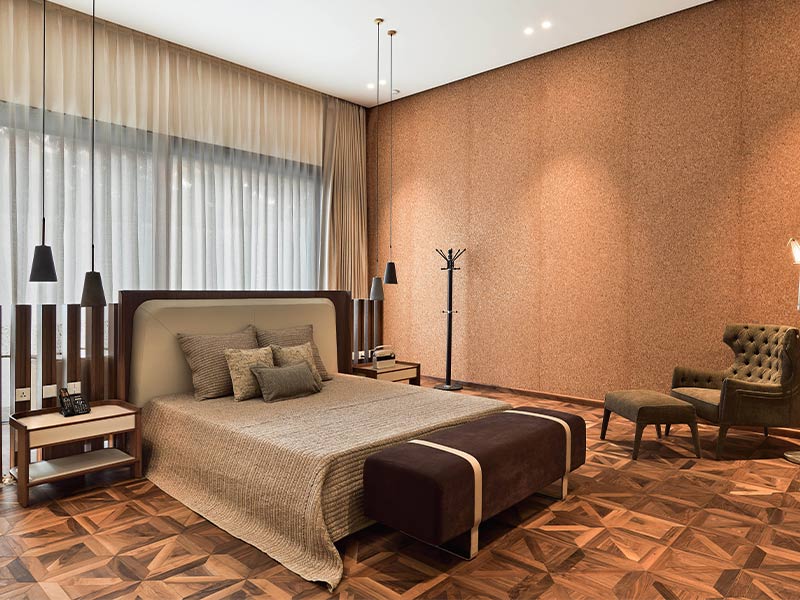 Geometric engineered wood flooring in a luxurious bedroom design - Beautiful Homes