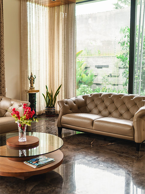 A sofa in beige leatherette