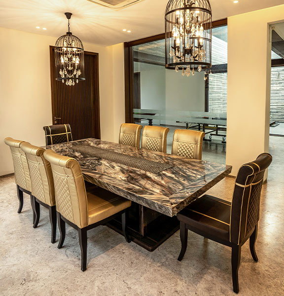 Plush dining room with dark marble slab