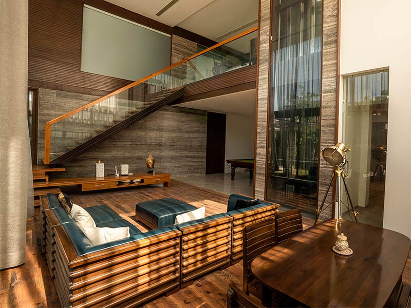 The voluminous living room area on the ground floor with its tall ceilings and subtle colours