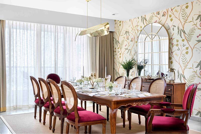 Brass banana leaf pendant light echoing in dining room - Beautiful Homes