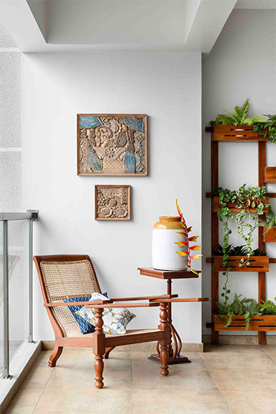 Wall of greens in verandah with plantation chair - Beautiful Homes