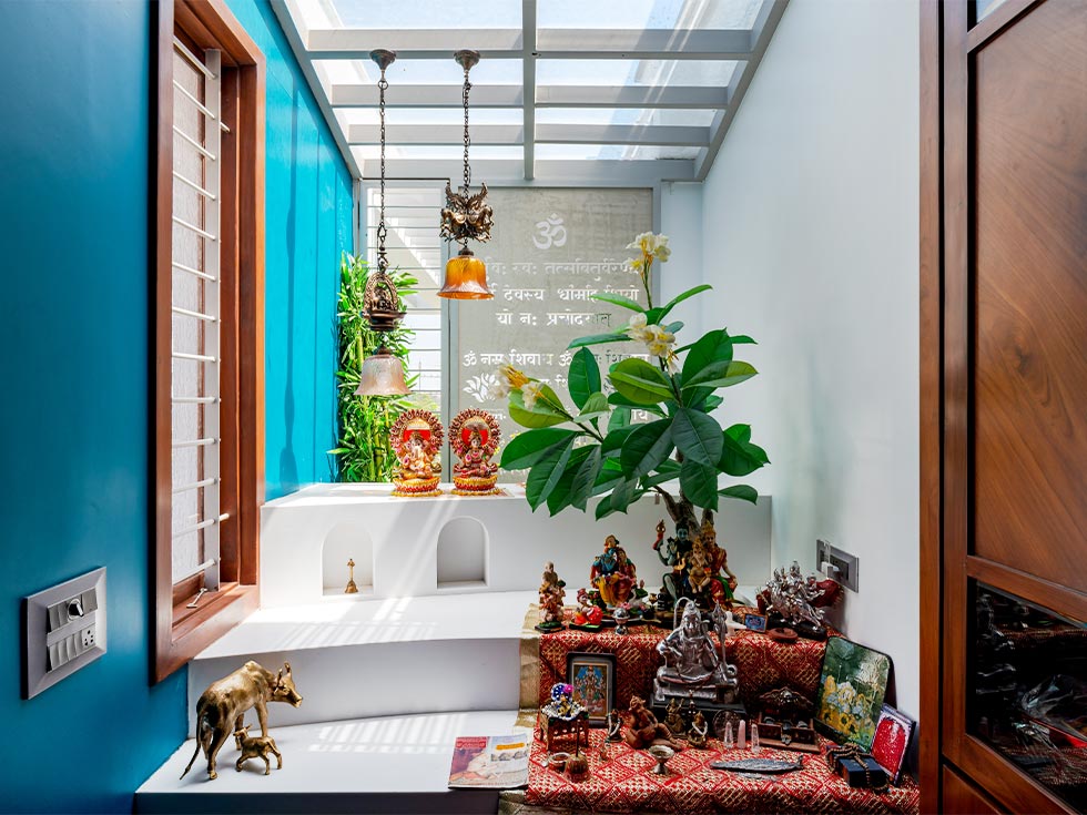 Temple design in the corner of the room fitted with glass doors - Beautiful Homes