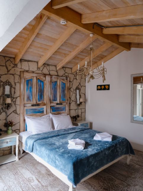 Exposed brick & velvet colours for the master bedroom - Beautiful Homes