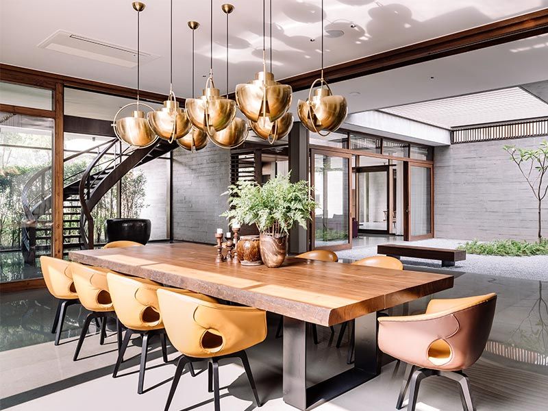 Dining room with an 8 seated teakwood dining table – Beautiful Homes