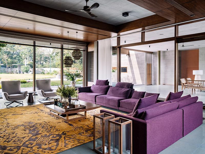 Living area with purple sofa design – Beautiful Homes