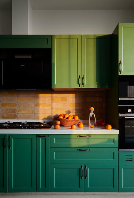 Modular kitchen design with green laminated cupboards – Beautiful Homes