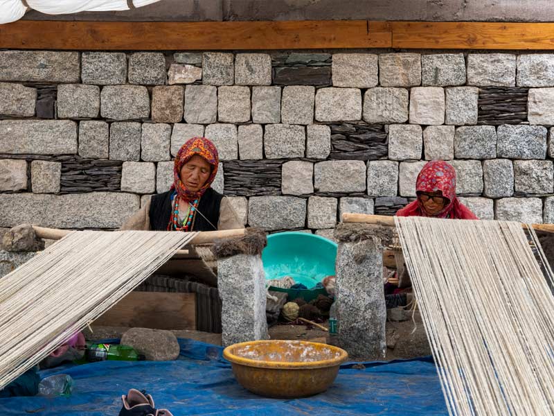 Women working on the loom in Leh - Beautiful Homes