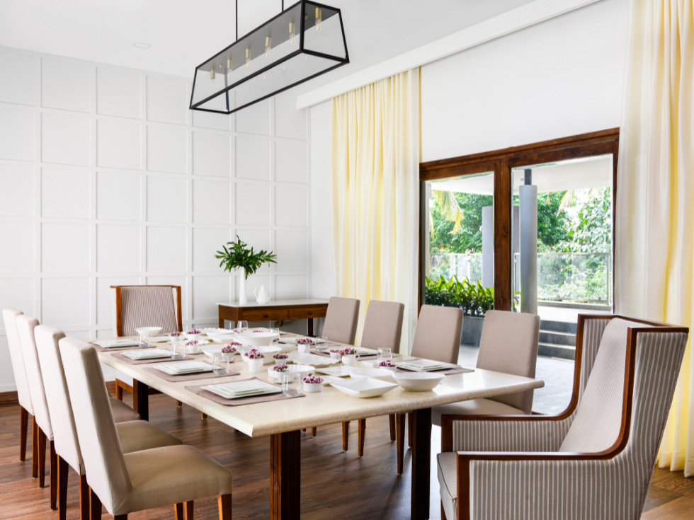 White Dining Room With 10-Seater Dining Table - Beautiful Homes