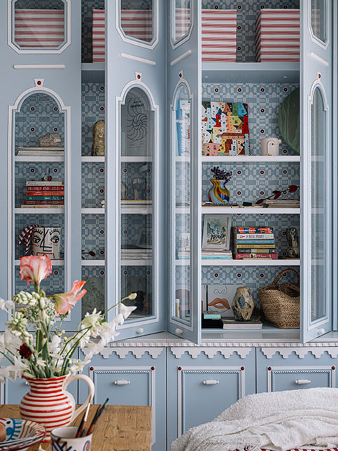 Soft Blue Cabinet With White Whimsical Detailing - Beautiful Homes