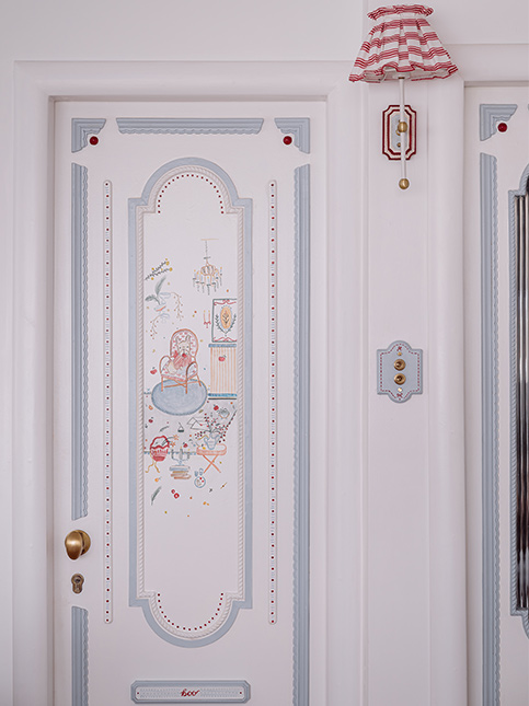 Whimsical White Door With Pastel Blue Details - Beautiful Homes