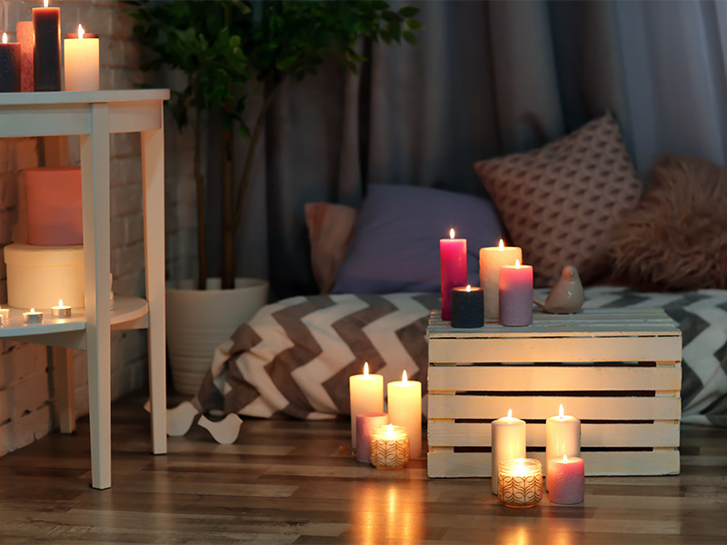 Dimmed Seating Space Lit Up with Candle Lights - Beautiful Homes