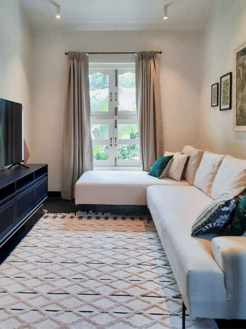 White Coloured L-shaped Sofa in Living Room - Beautiful Homes