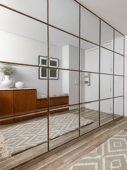 Full Length Hallway Designed with Large Mirror Squares - Beautiful Homes