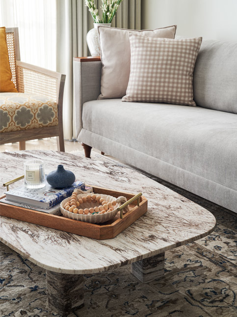 Living Room with Neutral Coloured Printed Rug - Beautiful Homes