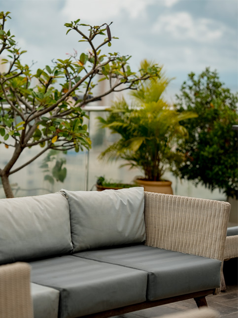 Balcony design with eight-seater sofa set - Beautiful Homes