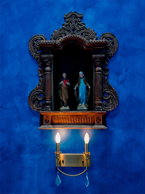 Bold blue wall design with antique wooden altar – Beautiful Homes