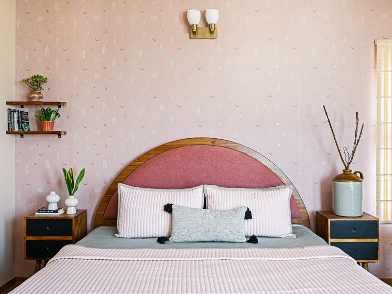 Pink bedroom with a circular headboard - Beautiful Homes