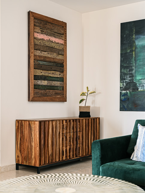 Wooden sideboard with hanging wall art - Beautiful Homes