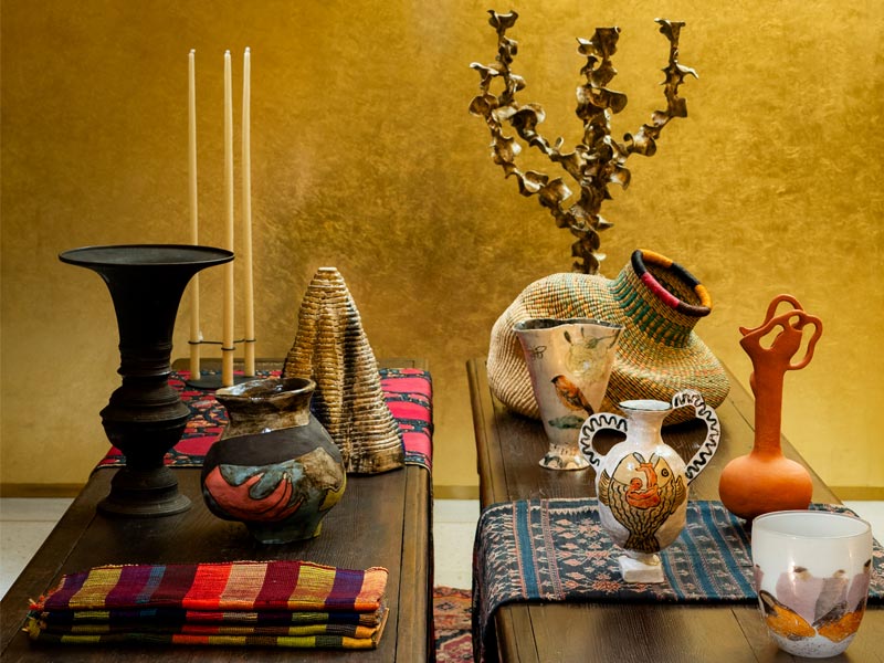 Yellowish Golden Wall and Décor Pieces on Table - Beautiful Homes