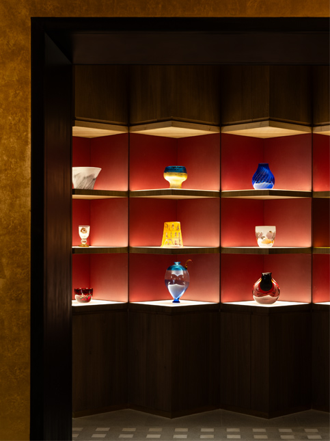 Illuminated Display Shelves with Red Background and Warm Light - Beautiful Homes