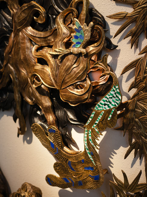 Brass wall art with butterfly and peacock motifs – Beautiful Homes