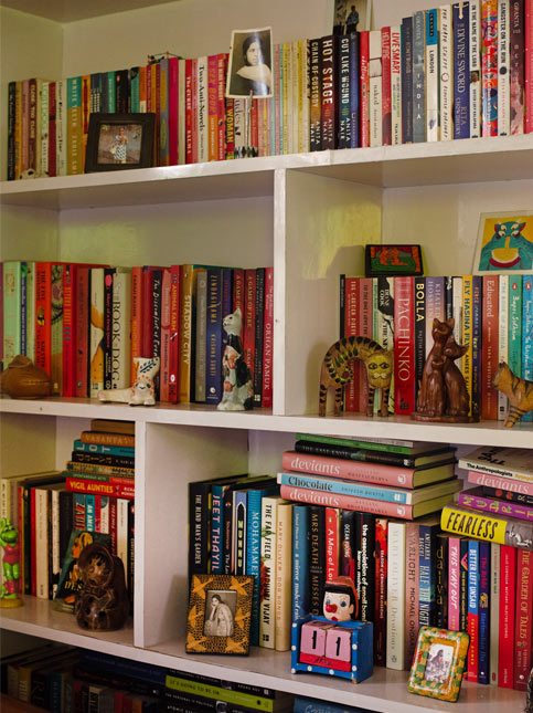 Beautiful Books Collection with Cute Décor Pieces on Shelf - Beautiful Homes