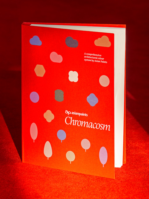 Chromacosm by Asian Paints, a vibrant red book with colourful amorphous shapes, showcases their expanded range of over 35,000 shades – Beautiful Homes