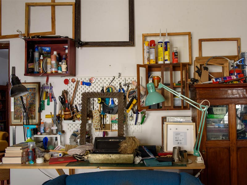 Art Studio Workspace with Pegboard, Tools, and Picture Frames – Beautiful Homes