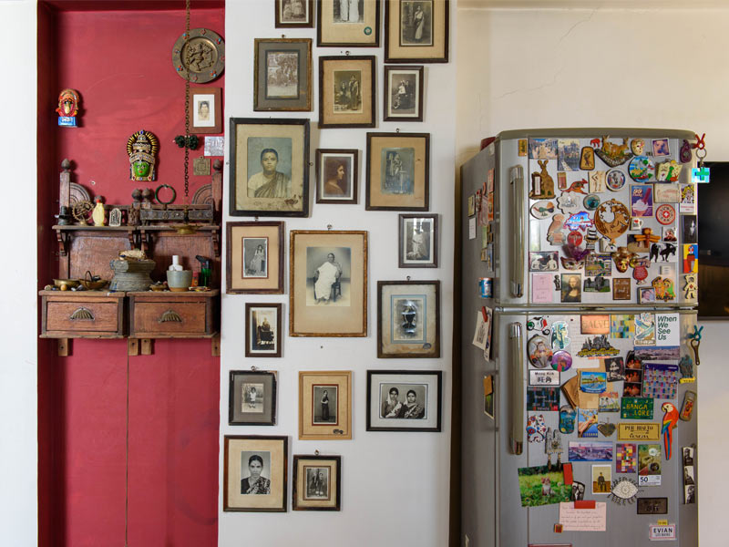 Gallery Wall of Vintage Photographs and Refrigerator Covered in Magnets – Beautiful Homes